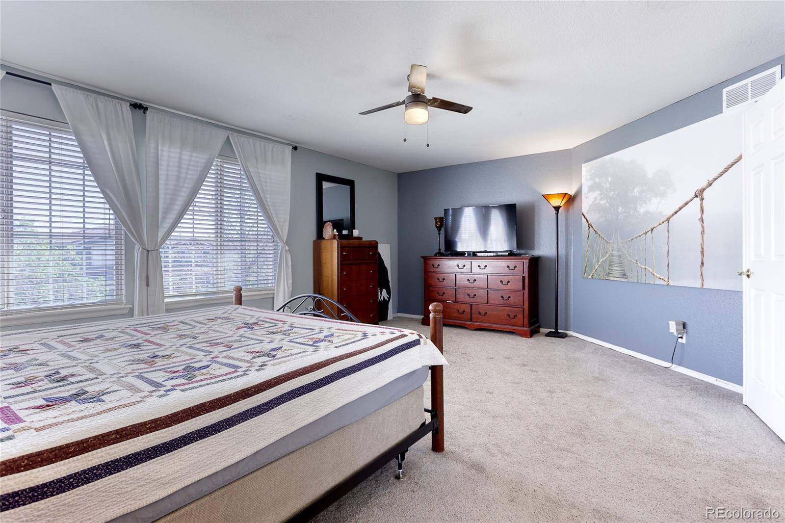 4425 Iran Street Denver, CO 80249 - Photo 22 of 36 a bed room with a bed and a window