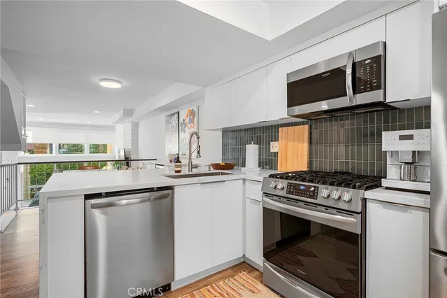 a kitchen with a stove and a microwave