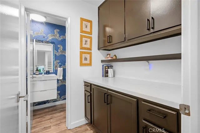 a kitchen with a sink and cabinets