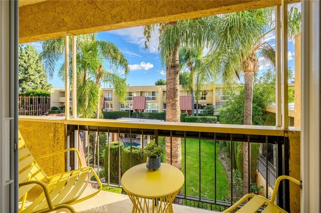 a view of a balcony with wooden floor