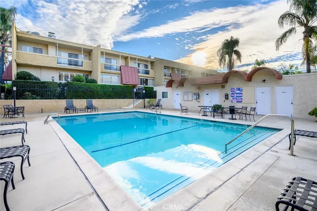 a view of swimming pool with chairs