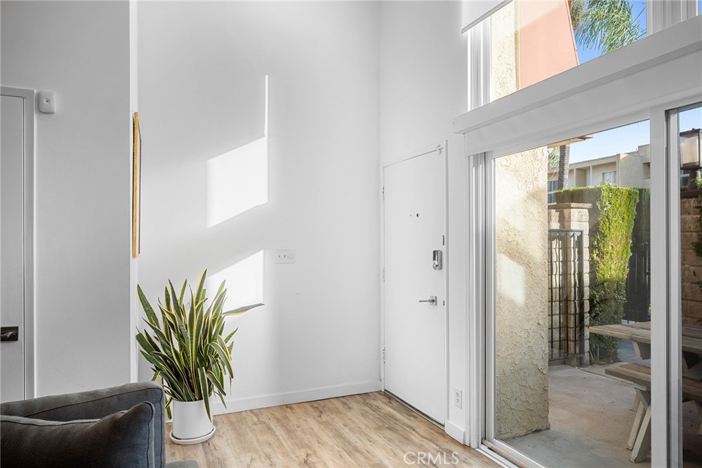 5435 Yarmouth Avenue, Unit 7 Encino, CA 91316 - Photo 3 of 31 a view of a potted plant in front of a glass door