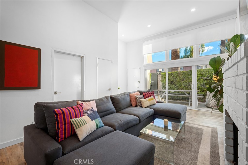 5435 Yarmouth Avenue, Unit 7 Encino, CA 91316 - Photo 7 of 31 a living room with furniture and a large window