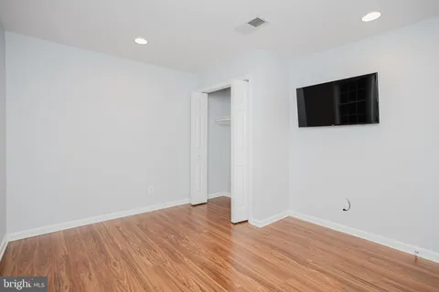 a view of a livingroom with wooden floor
