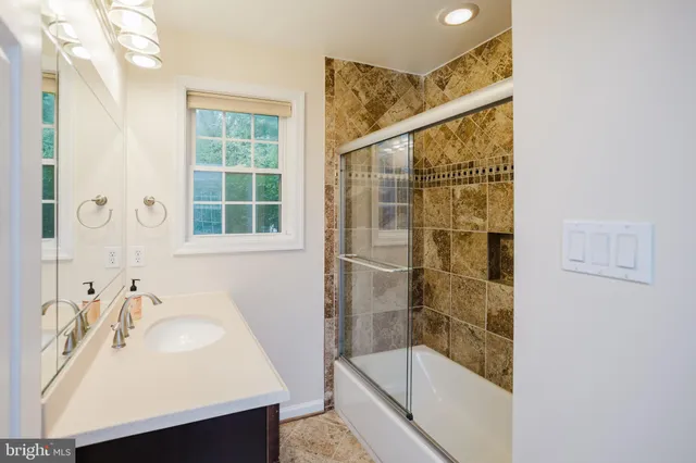 a bathroom with a sink and a shower