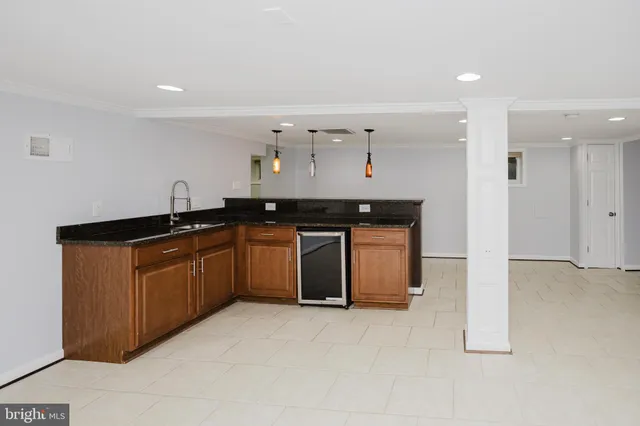 a kitchen with a sink and cabinets