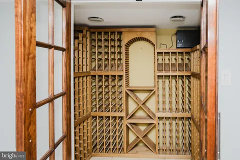 a view of an empty room with closet and entryway