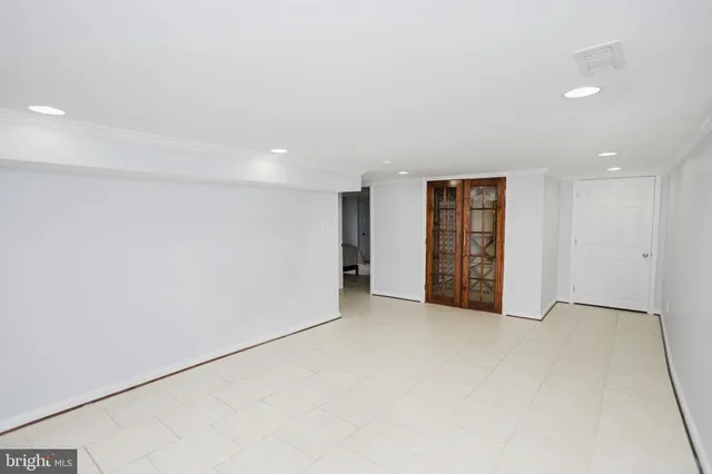 a kitchen with stainless steel appliances granite countertop a refrigerator a sink and a stove