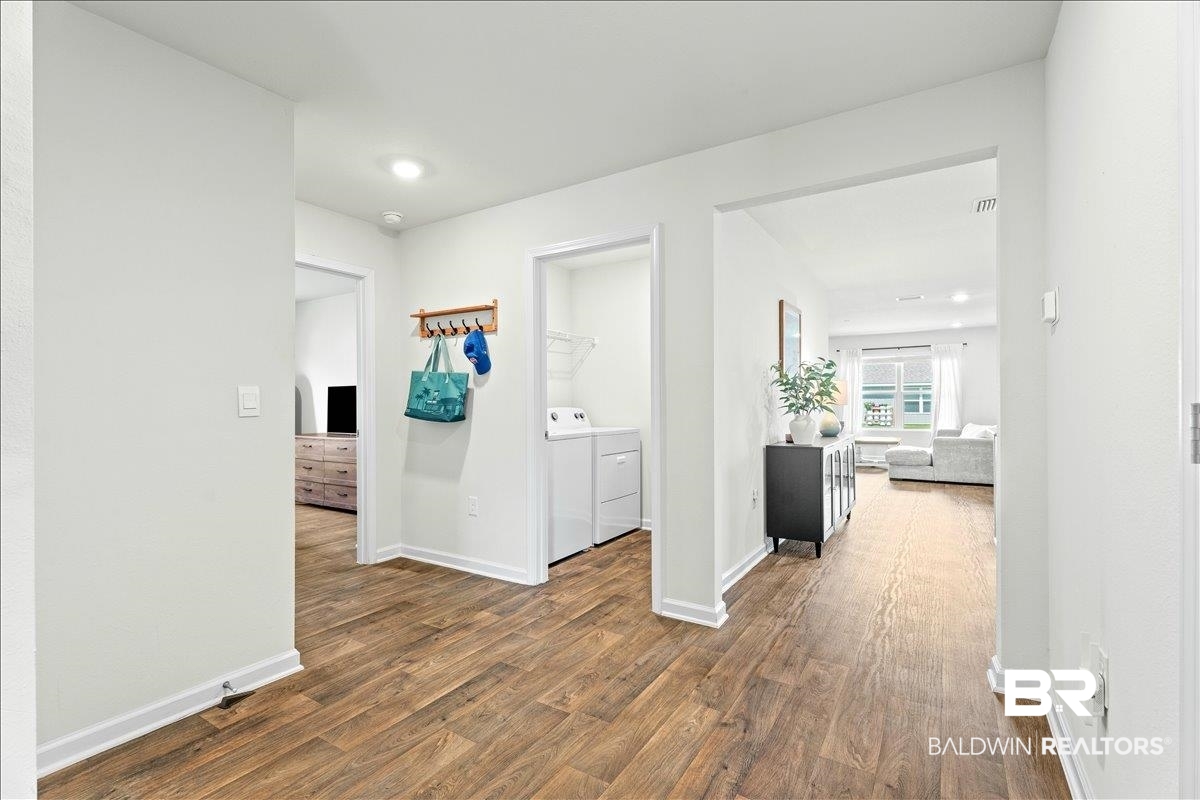 23641 Unbridled Loop Daphne, AL 36526 - Photo 6 of 40 Entryway with wood-finish flooring and bright white walls