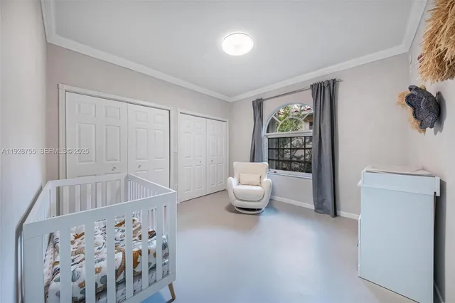 a bed room with a bed and a window