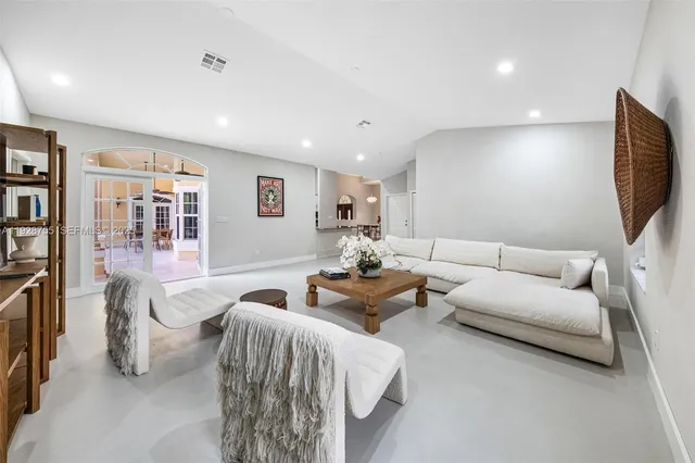 a view of a house with swimming pool and sitting area