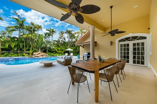 a view of a patio with a table and chairs