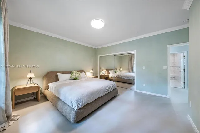 a view of a dining room with furniture chandelier and a rug