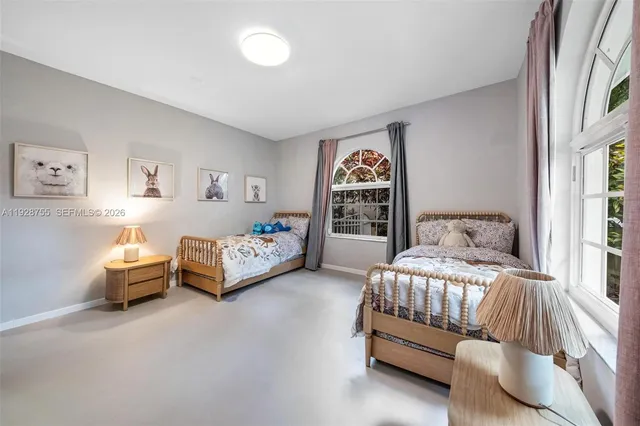 a view of a room with wooden floor and windows