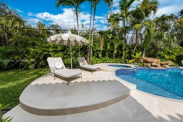 a spacious bedroom with a bed and a walk in closet