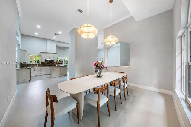 a bathroom with a tub shower and mirror
