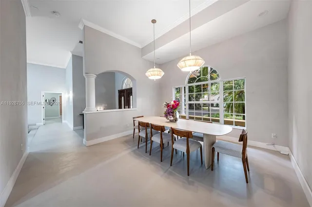 a view of a dining room with furniture and window