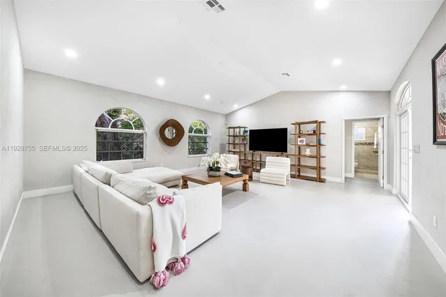 a view of a patio with a table and chairs