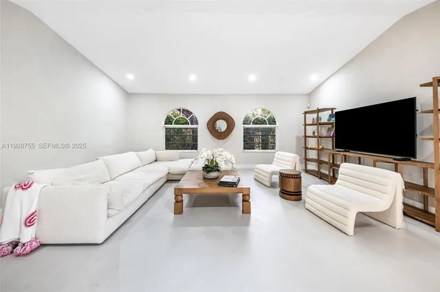 a view of a dining room with furniture and a window