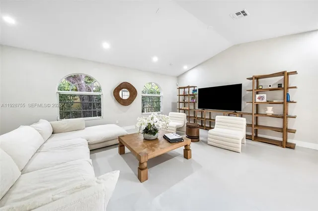 a view of a swimming pool with a lounge chair