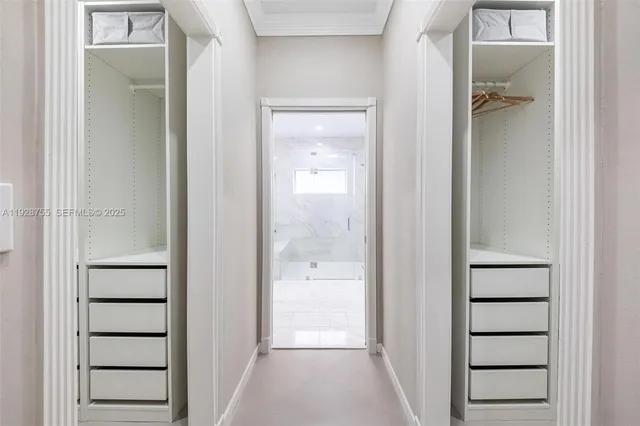 a view of pool with lawn chairs under an umbrella