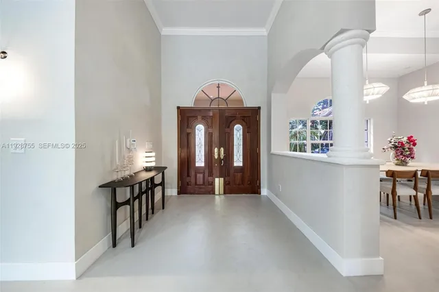 a kitchen with stainless steel appliances kitchen island granite countertop a sink and cabinets