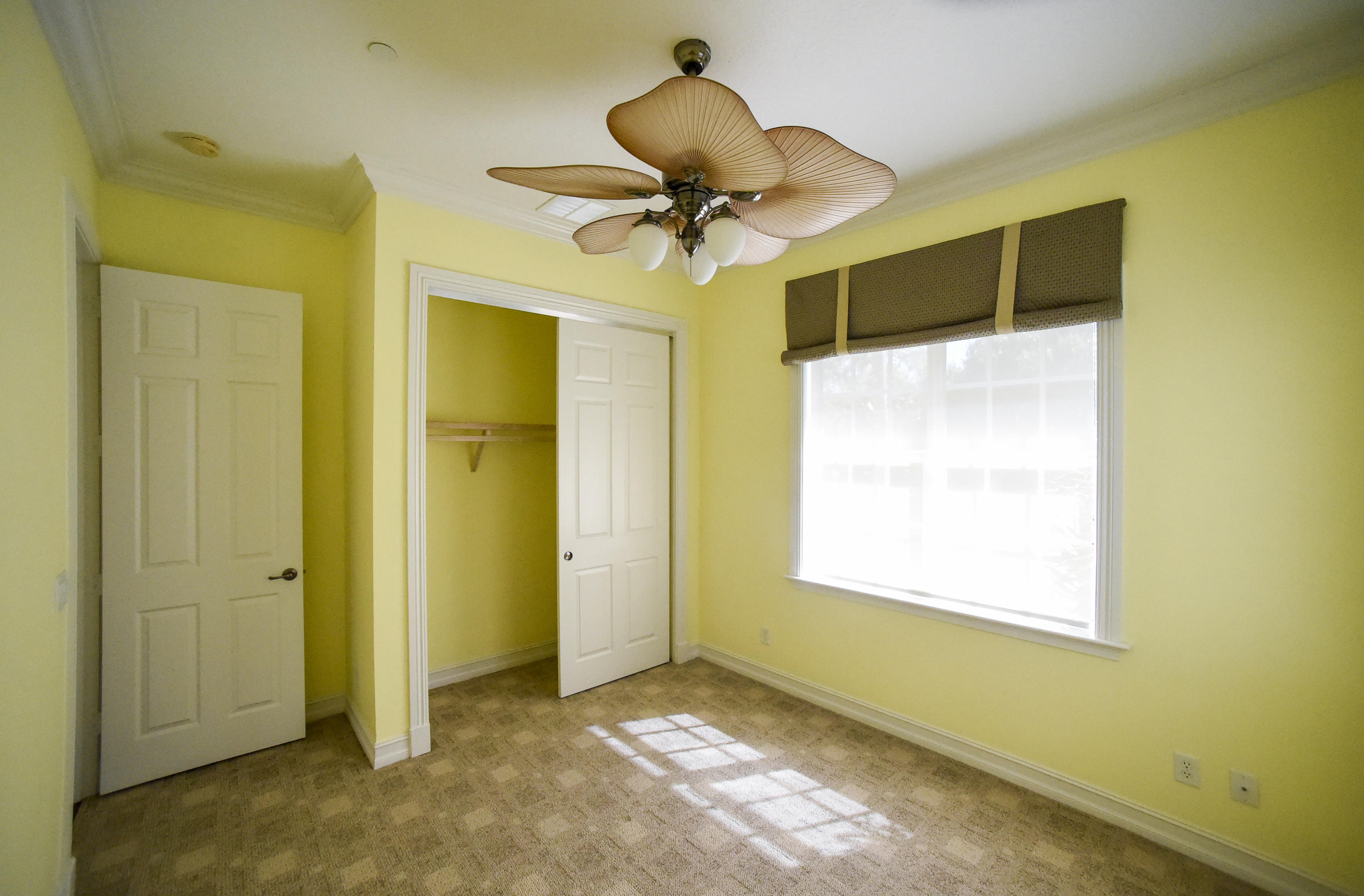 552 Southwest St Lucie Crescent Stuart, FL 34994 - Photo 17 of 36 a view of a livingroom with a chandelier fan and a window
