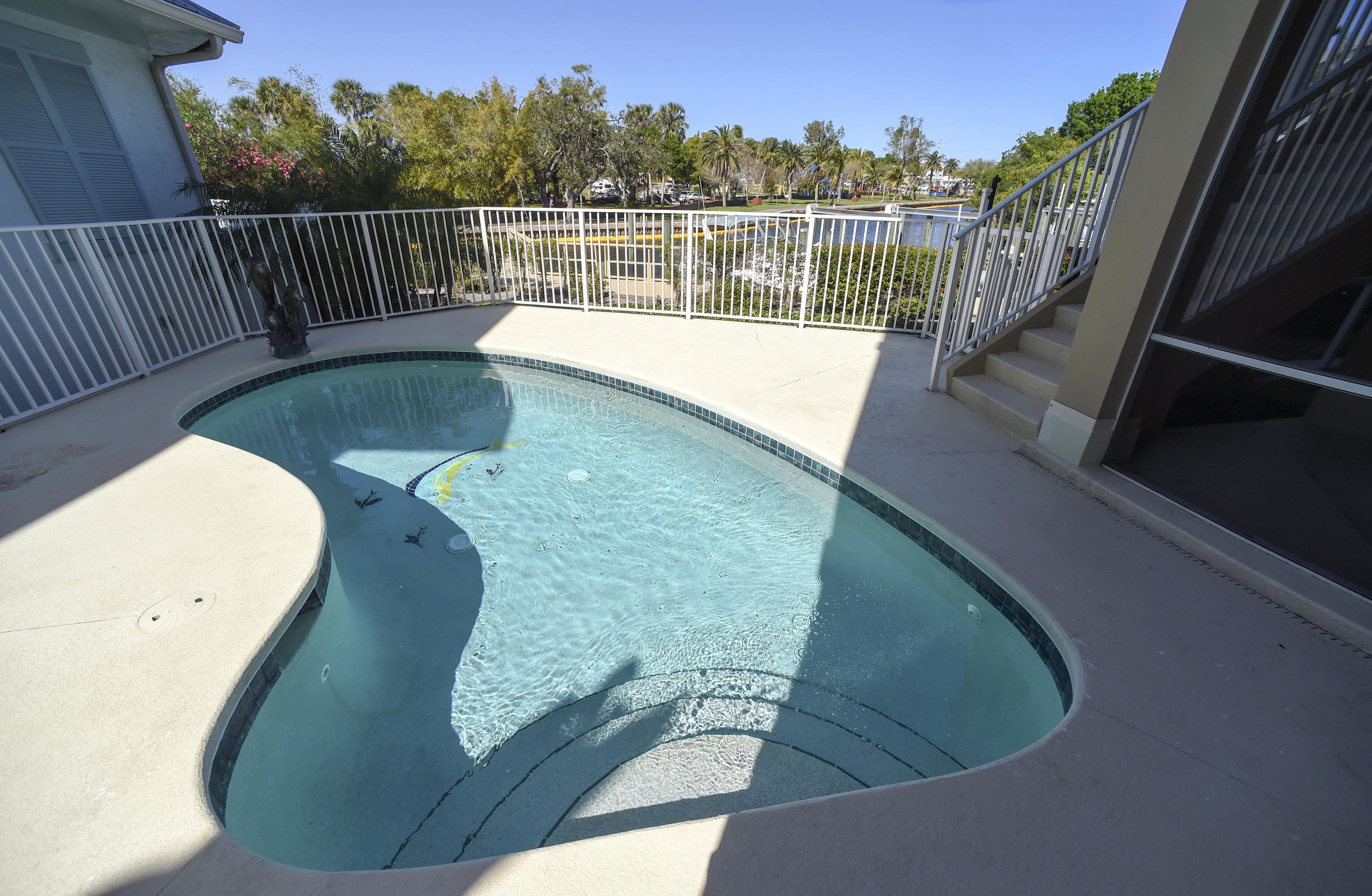 552 Southwest St Lucie Crescent Stuart, FL 34994 - Photo 31 of 36 a view of a balcony with floor to ceiling window and wooden floor