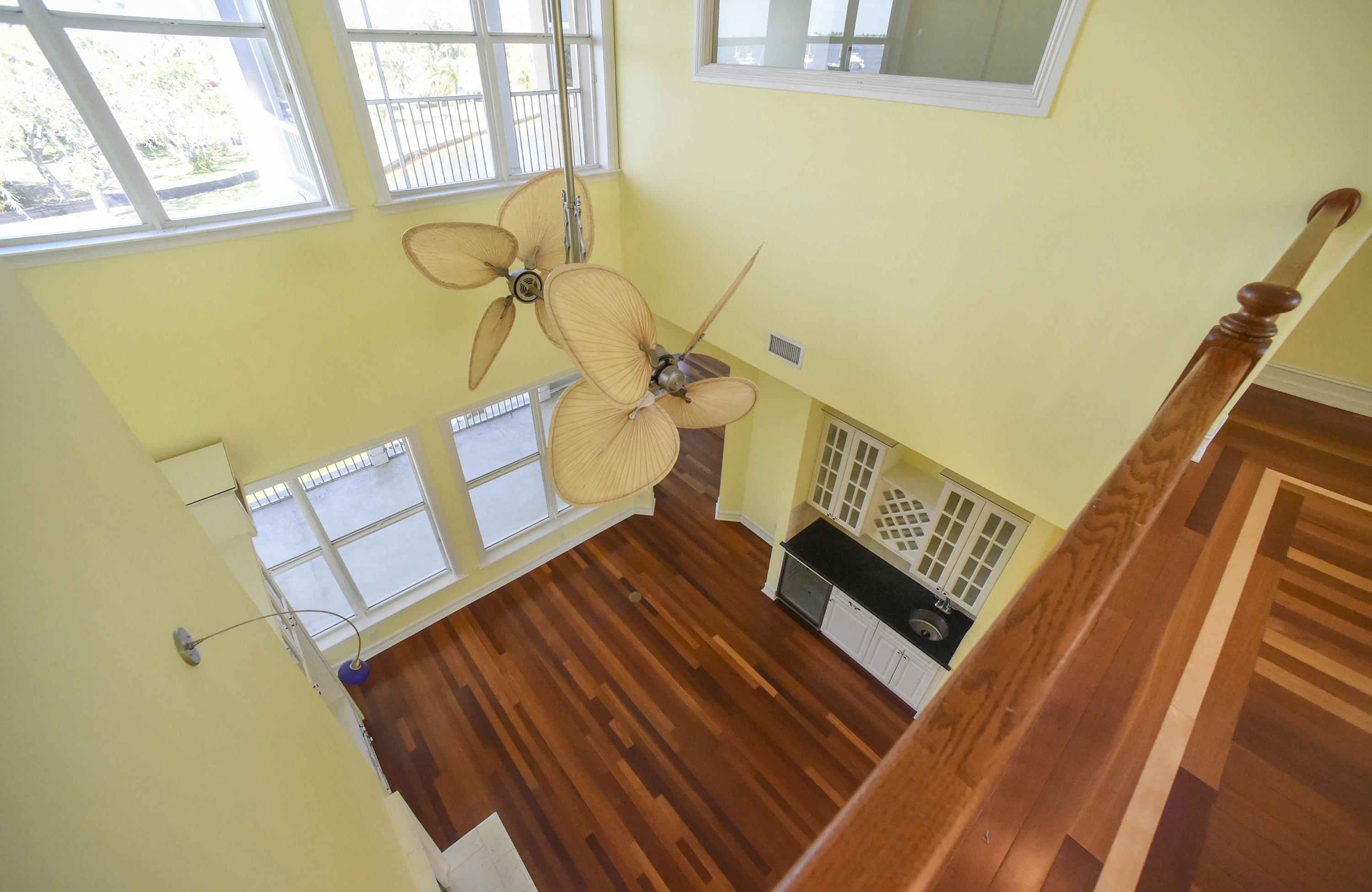 552 Southwest St Lucie Crescent Stuart, FL 34994 - Photo 5 of 36 a view of stairs and wooden floor
