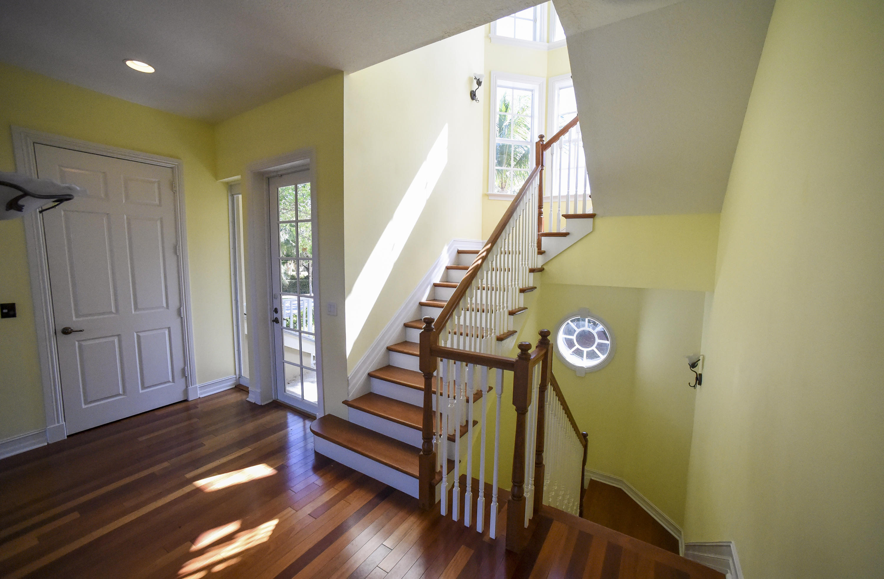 552 Southwest St Lucie Crescent Stuart, FL 34994 - Photo 6 of 36 a view of entryway and hall with wooden floor