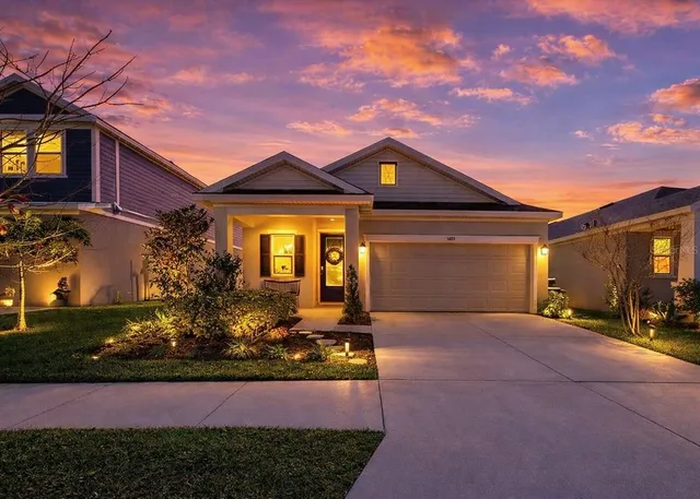 a front view of a house with yard