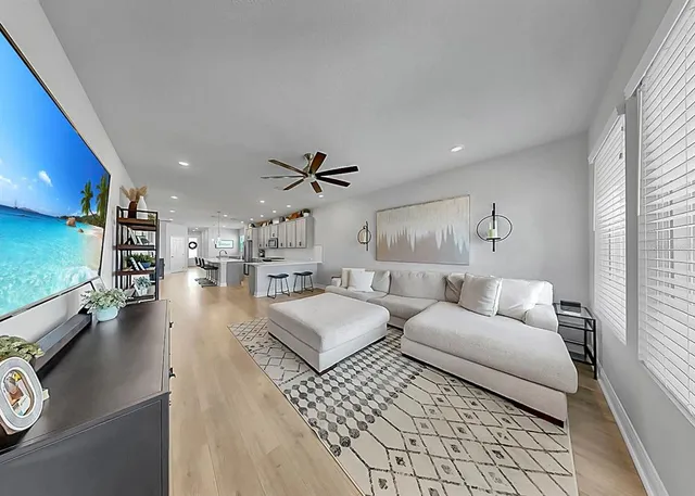 a living room with furniture and a table