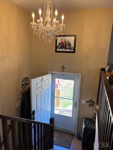 a view of a hallway with chandelier