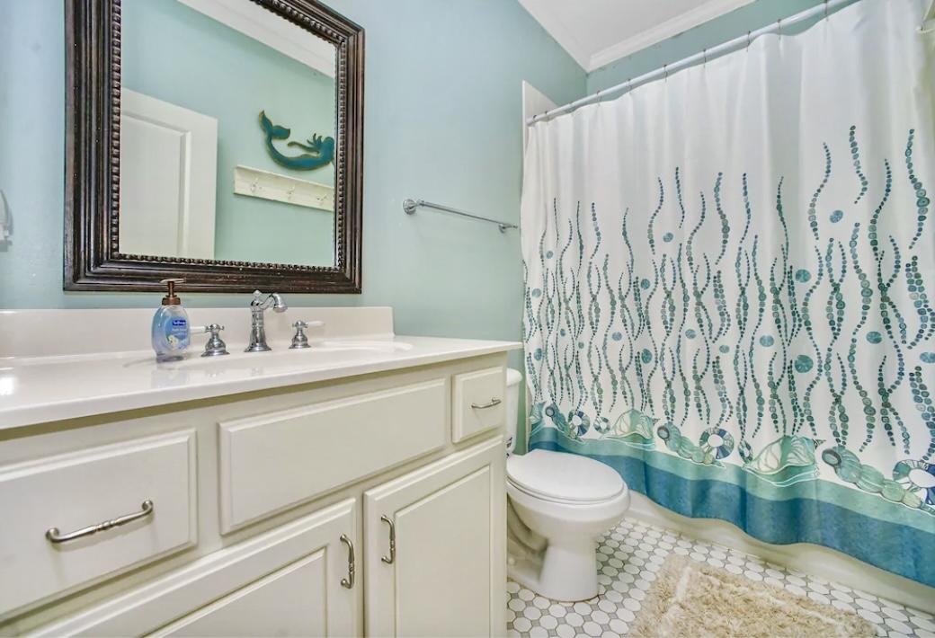 75 Hidden Lake Way Santa Rosa Beach, FL 32459 - Photo 26 of 49 a bathroom with a granite countertop sink a toilet and a mirror