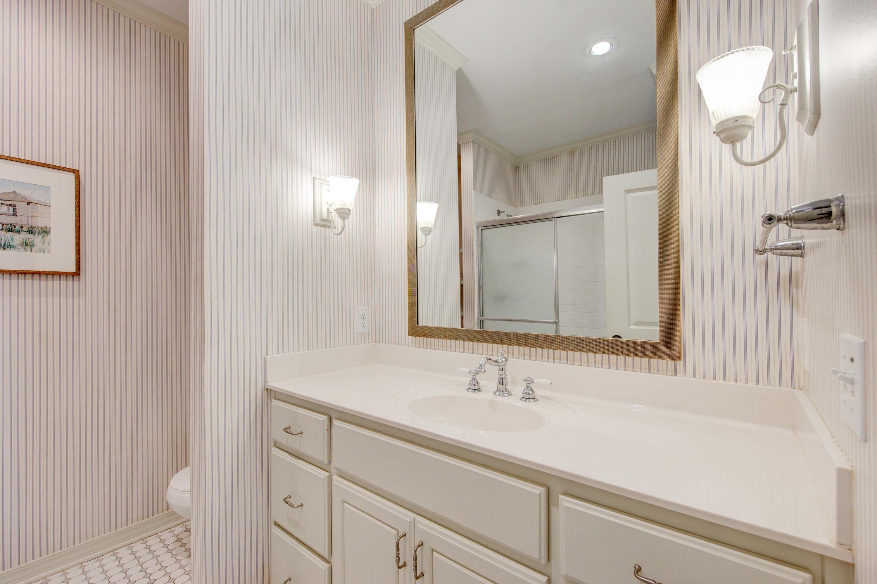 75 Hidden Lake Way Santa Rosa Beach, FL 32459 - Photo 34 of 49 a bathroom with a sink and a mirror