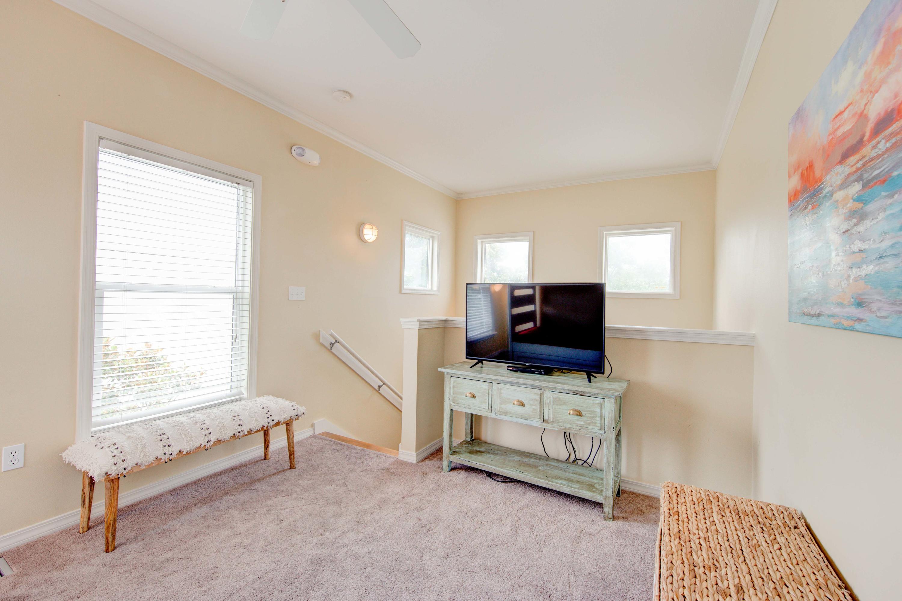 75 Hidden Lake Way Santa Rosa Beach, FL 32459 - Photo 35 of 49 a living room with furniture and a flat screen tv