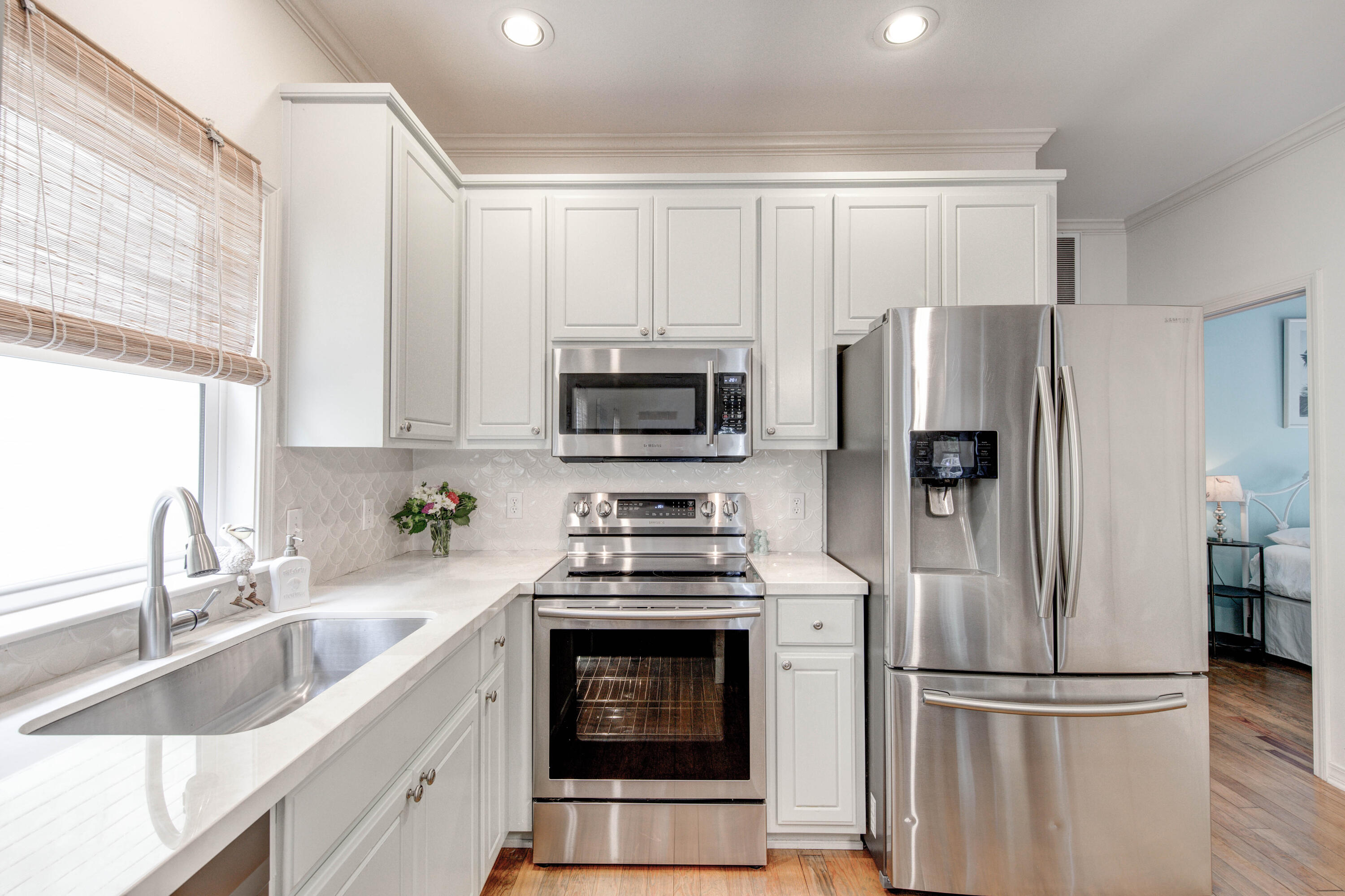 75 Hidden Lake Way Santa Rosa Beach, FL 32459 - Photo 10 of 49 a kitchen with a refrigerator sink and microwave