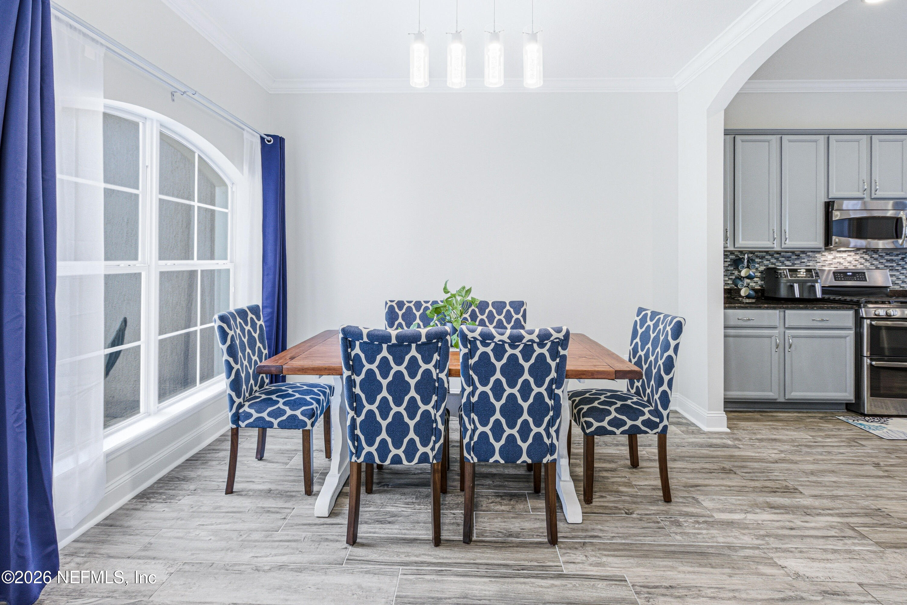 191 South Arabella Way St. Johns, FL 32259 - Photo 9 of 57 a dining room with furniture and wooden floor