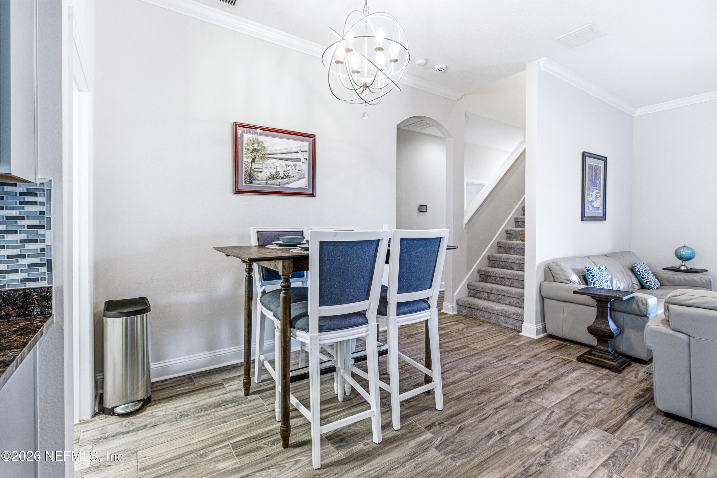191 South Arabella Way St. Johns, FL 32259 - Photo 12 of 57 a view of a dining room with furniture and wooden floor