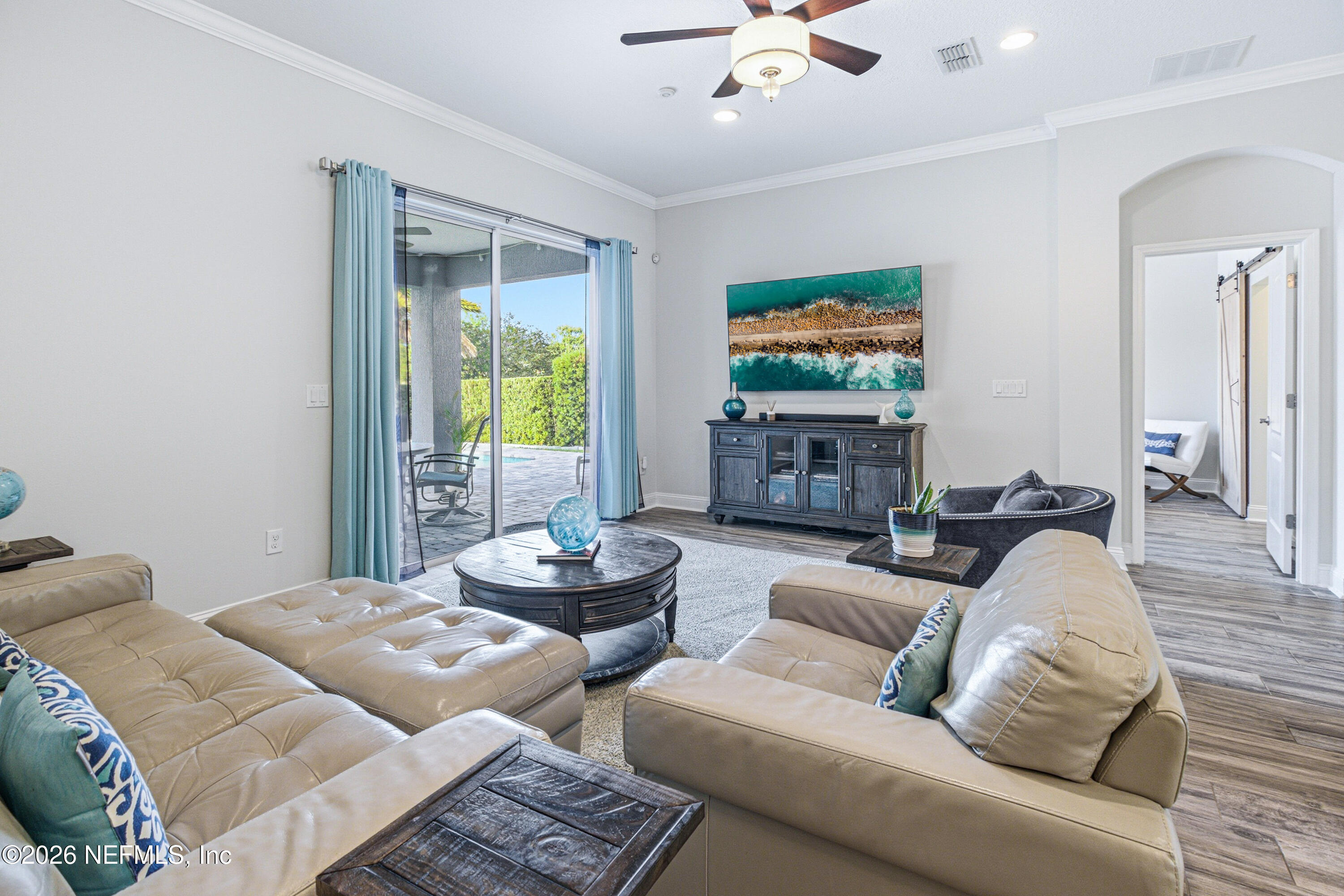 191 South Arabella Way St. Johns, FL 32259 - Photo 15 of 57 a living room with furniture and a flat screen tv