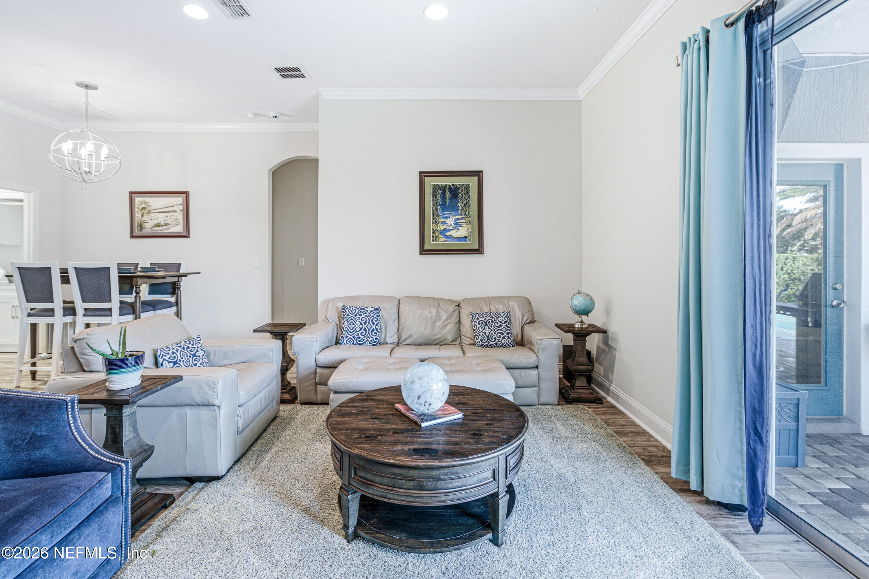 191 South Arabella Way St. Johns, FL 32259 - Photo 17 of 57 a living room with furniture a rug and a painting