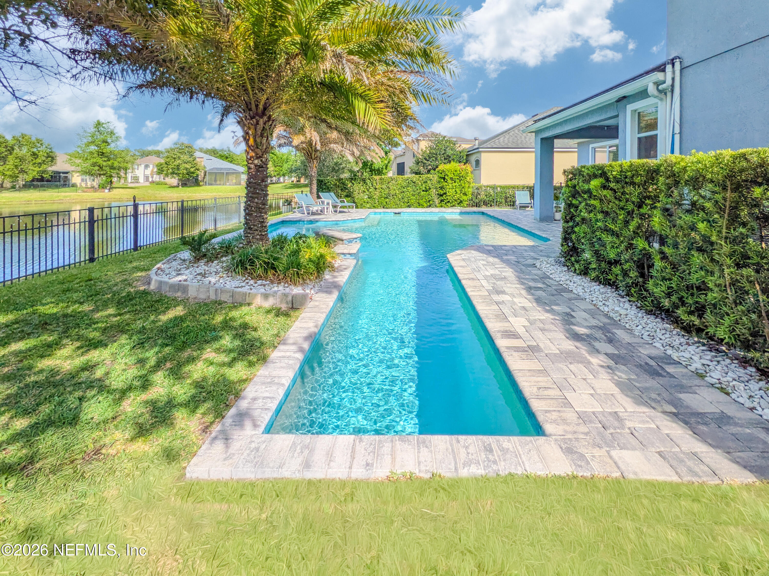 191 South Arabella Way St. Johns, FL 32259 - Photo 21 of 57 a view of swimming pool with a garden