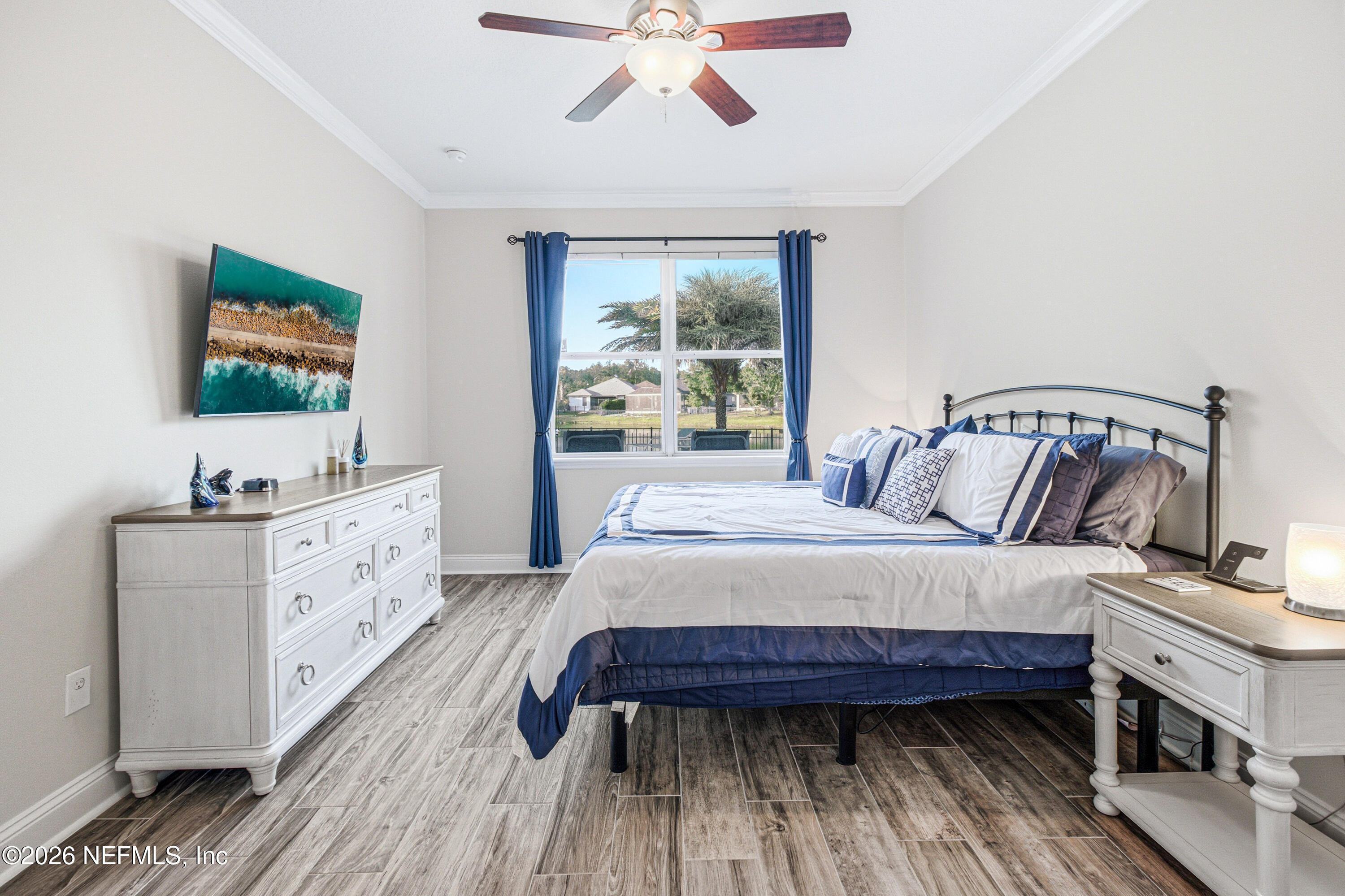 191 South Arabella Way St. Johns, FL 32259 - Photo 23 of 57 a bedroom with a bed and a flat screen tv