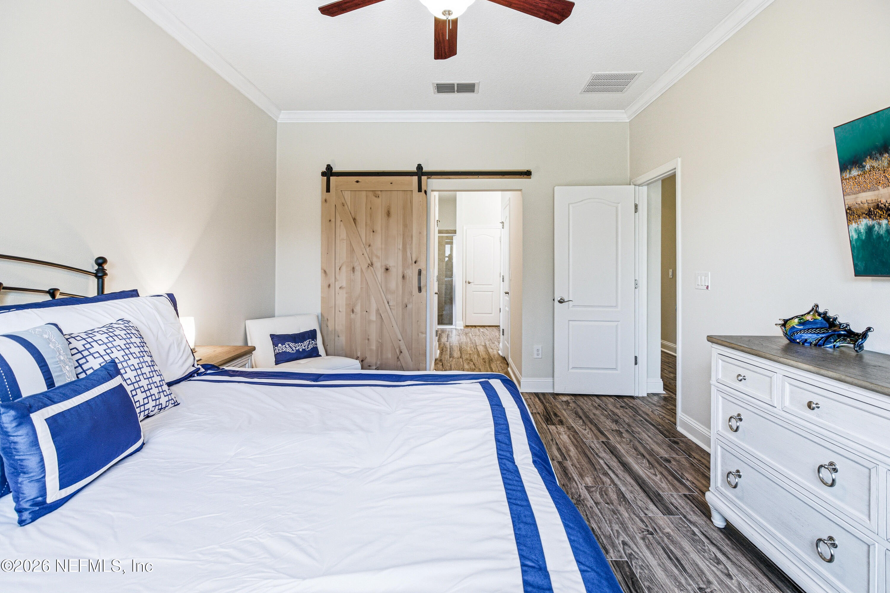 191 South Arabella Way St. Johns, FL 32259 - Photo 24 of 57 a bedroom with a bed and a dresser