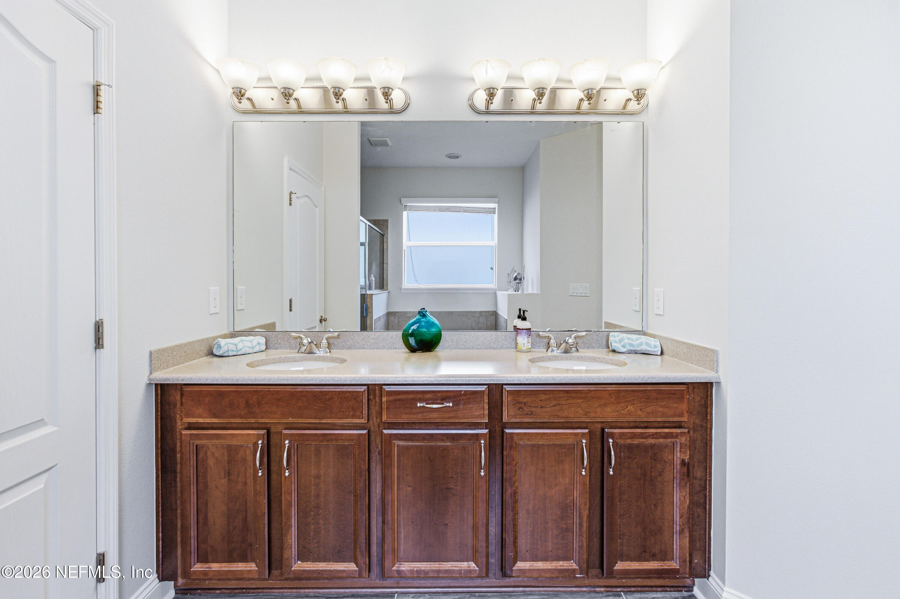 191 South Arabella Way St. Johns, FL 32259 - Photo 27 of 57 a bathroom with a sink and a mirror
