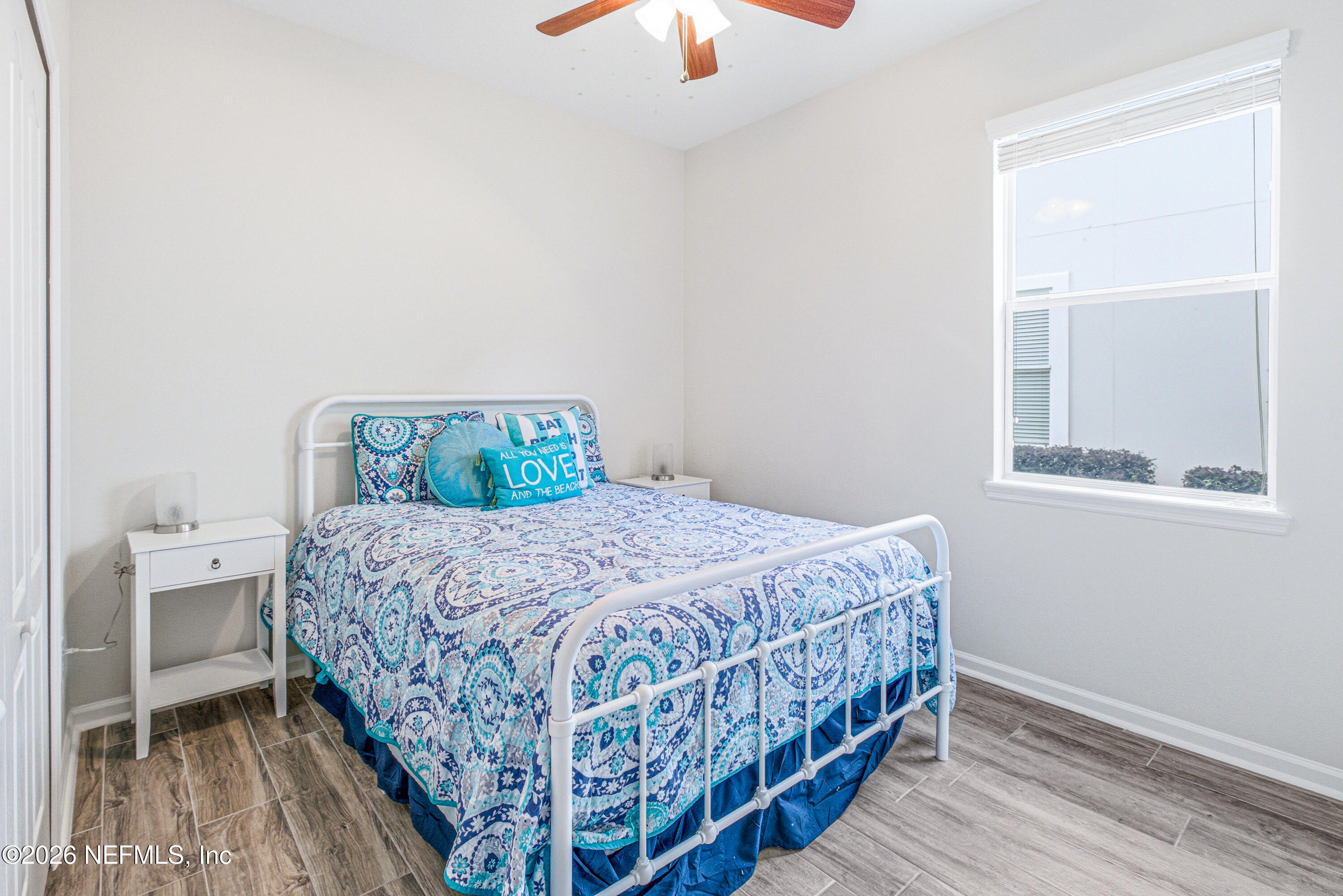 191 South Arabella Way St. Johns, FL 32259 - Photo 29 of 57 a bedroom with a bed and a window