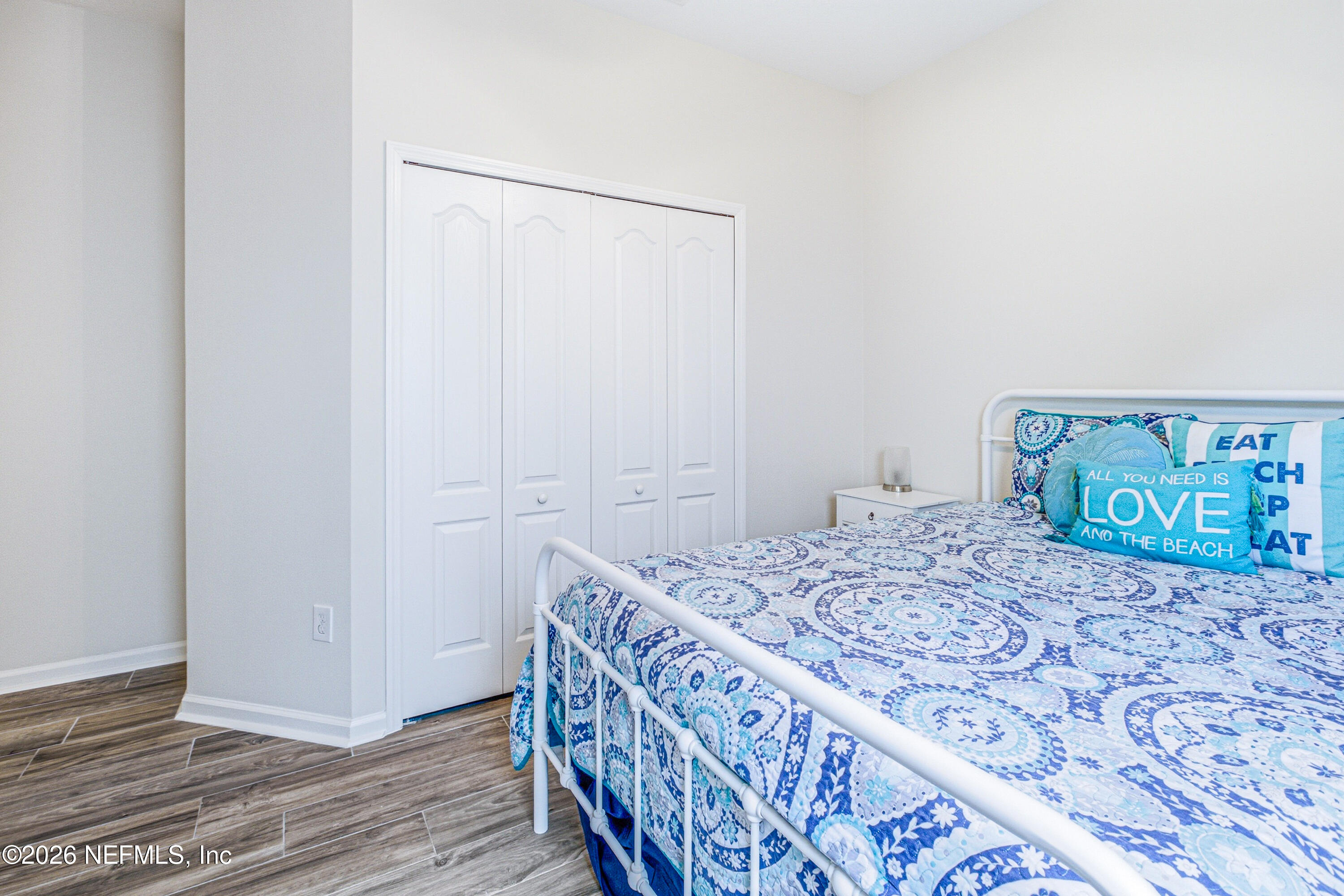 191 South Arabella Way St. Johns, FL 32259 - Photo 30 of 57 a bedroom with a bed and a painting on the wall