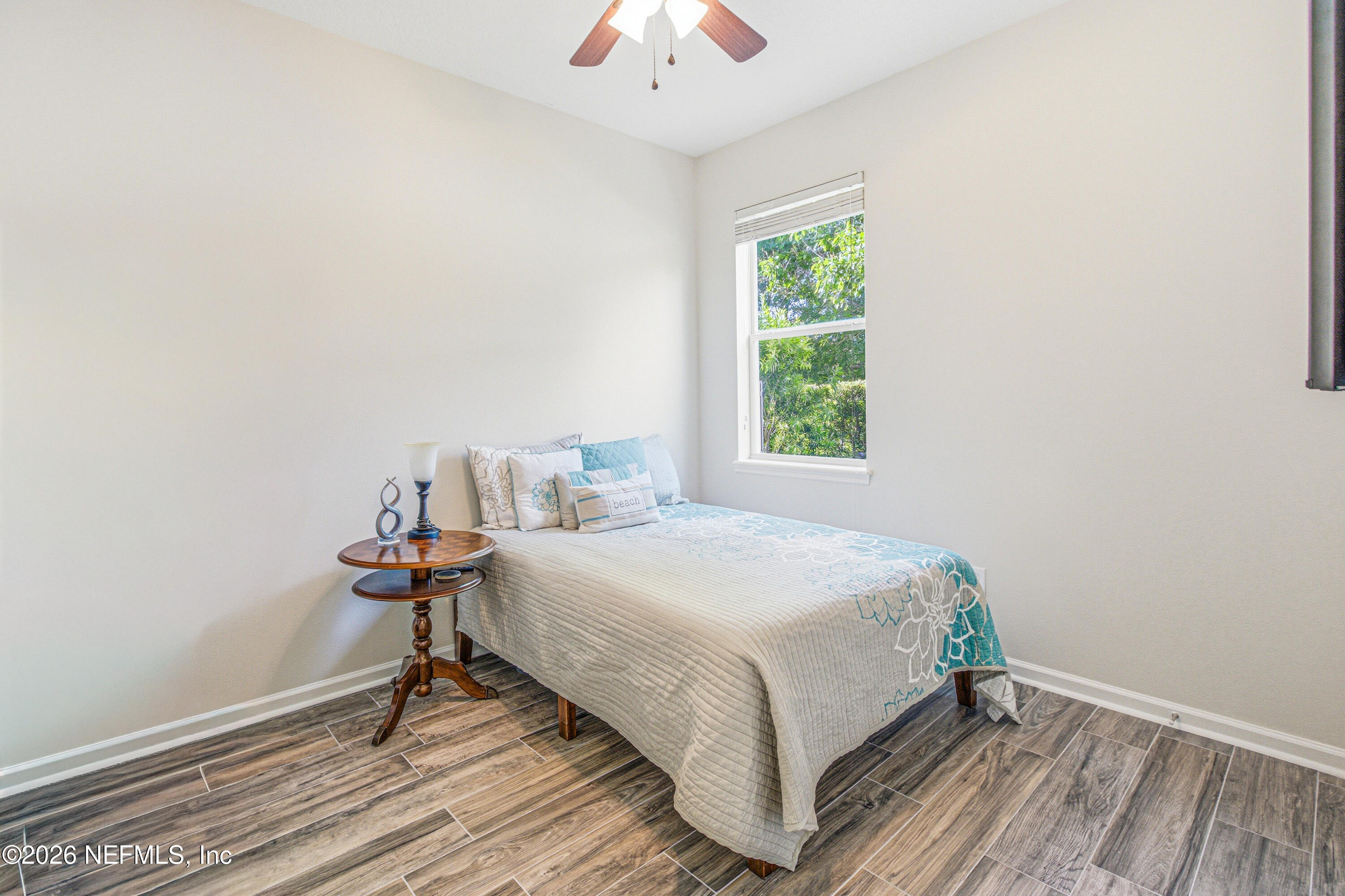 191 South Arabella Way St. Johns, FL 32259 - Photo 34 of 57 a bed sitting in a bedroom next to a window
