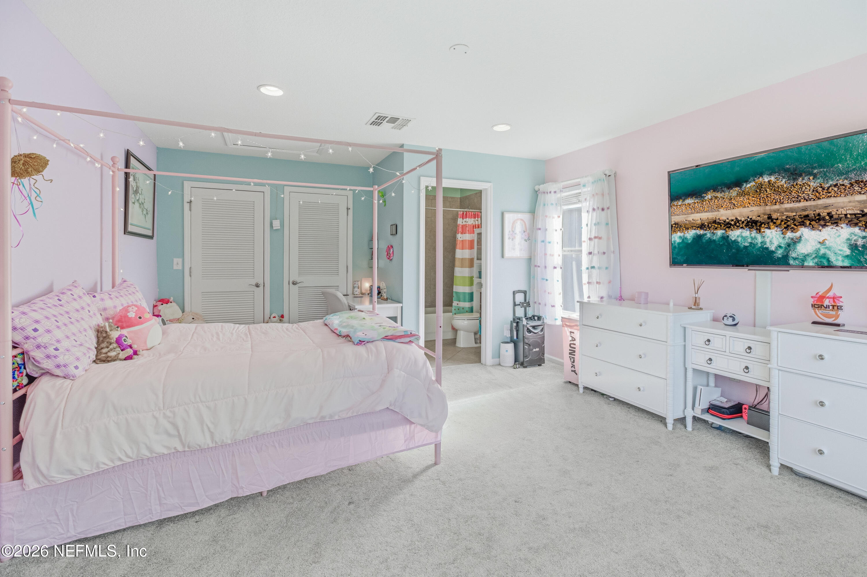 191 South Arabella Way St. Johns, FL 32259 - Photo 39 of 57 a bedroom with a bed dresser and flat screen tv
