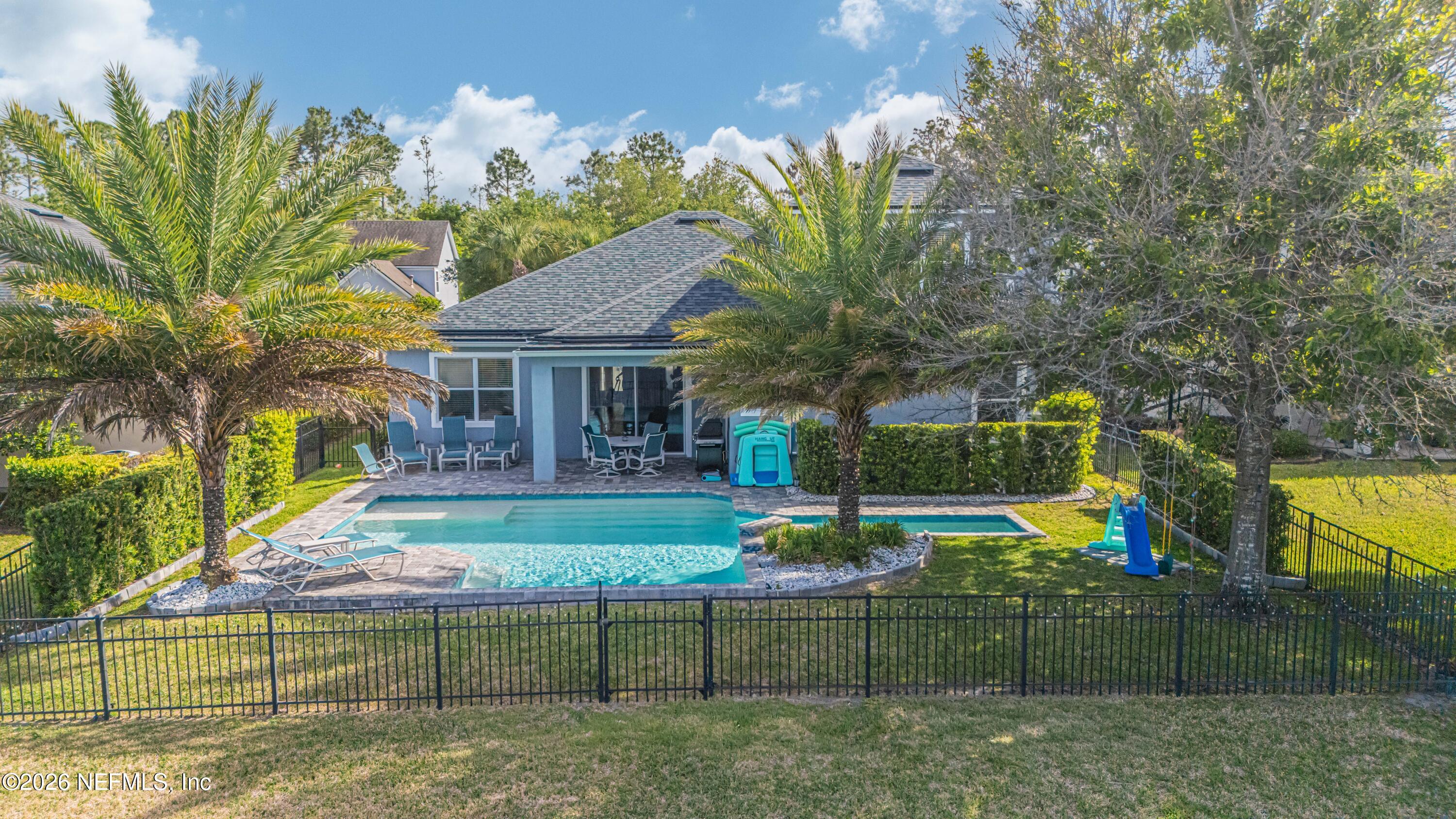 191 South Arabella Way St. Johns, FL 32259 - Photo 42 of 57 a front view of a house with garden